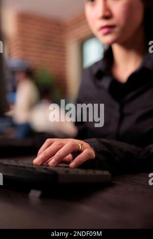 Freelance coder programming html server code algorithm on computer, sitting at desk in it agency office. Software developer working with html database script in cyber security agency. Close up Stock Photo