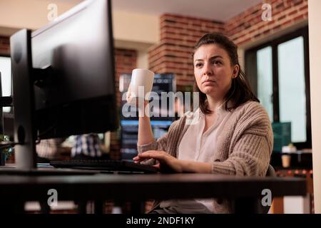Software developer writing html code on computer, sitting at desk parsing algorithm in it programming agency. Tech enginners working on app developing program. network technology concept Stock Photo