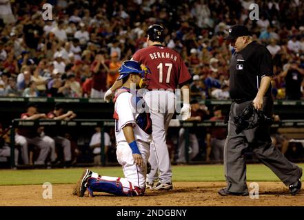 Houston Astros' Lance Berkman walks back to the dugout after