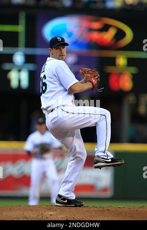 Seattle Mariners starting pitcher Cliff Lee signs autographs on the team's  first day of baseball spring training for pitchers and catchers, Thursday,  Feb. 18, 2010, in Peoria, Ariz. (AP Photo/Charlie Neibergall Stock