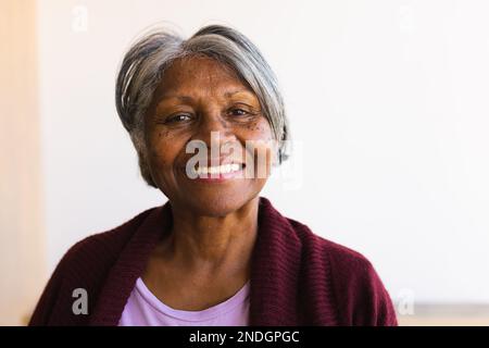 Portrait of african american senior woman smiling at home. retirement senior lifestyle and living concept Stock Photo