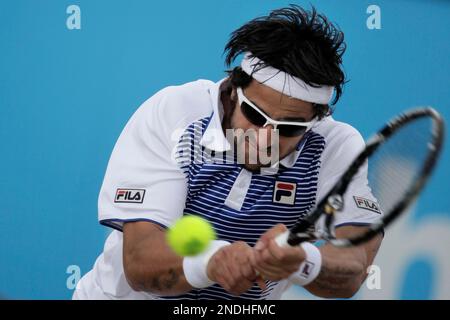 Janko Tipsarevic of Serbia returns in the final against Sergiy 