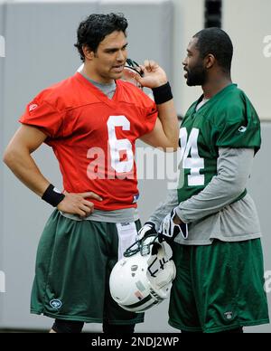 New York Jets Mark Sanchez takes off his helmet after greeting