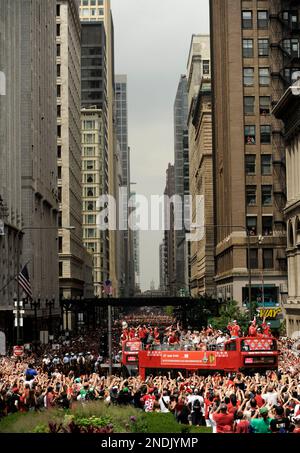 https://l450v.alamy.com/450v/2ndjymp/the-chicago-blackhawks-celebrate-with-fans-during-a-parade-at-washington-street-and-michigan-ave-honoring-the-blackhawks-winning-the-stanley-cup-in-chicago-friday-june-11-2010-ap-photopaul-beaty-2ndjymp.jpg