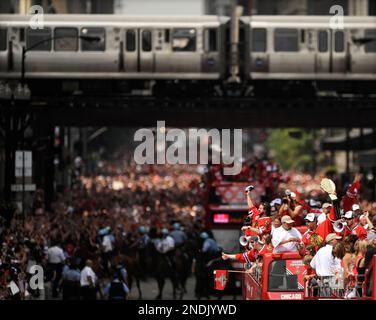 https://l450v.alamy.com/450v/2ndjywd/the-chicago-blackhawks-celebrate-with-fans-during-a-parade-on-washington-street-honoring-the-blackhawks-winning-the-stanley-cup-in-chicago-friday-june-11-2010-ap-photopaul-beaty-2ndjywd.jpg