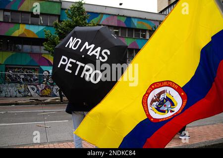 A demonstrator holds an umbrella with the message 'No More Petro' during the demonstrations against the reform proposals of Colombian president Gustavo Petro, in Bogota, Colombia, February 15, 2023. Photo by: Chepa Beltran/Long Visual Press Stock Photo