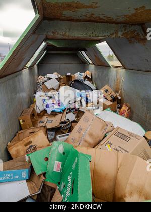 Trash and garbage and recycled paper and plastic in recycle bins in Montgomery Alabama, USA. Stock Photo