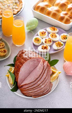 Traditional Easter ham on the table served with Easter brunch Stock Photo