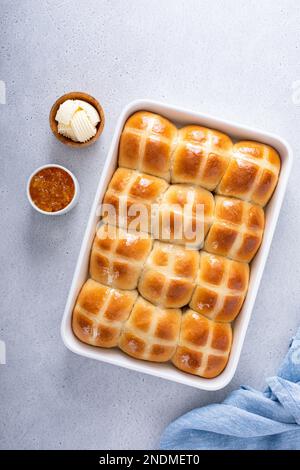 Traditional hot cross buns freshly baked for Easter brunch in a pan Stock Photo