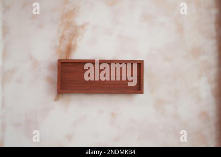Wooden frame decorated on wall, stock photo Stock Photo