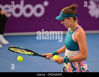 Doha, Qatar. 15th Feb, 2023. Belinda Bencic of Switzerland prepares to serve during the singles round of 16 match against Victoria Azarenka of Belarus at WTA500 Qatar Open 2023 in Doha, Qatar, Feb. 15, 2023. Credit: Nikku/Xinhua/Alamy Live News Stock Photo