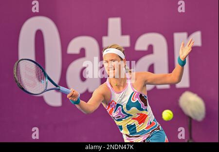 Doha, Qatar. 15th Feb, 2023. Victoria Azarenka of Belarus hits a return during the singles round of 16 match against Belinda Bencic of Switzerland at WTA500 Qatar Open 2023 in Doha, Qatar, Feb. 15, 2023. Credit: Nikku/Xinhua/Alamy Live News Stock Photo