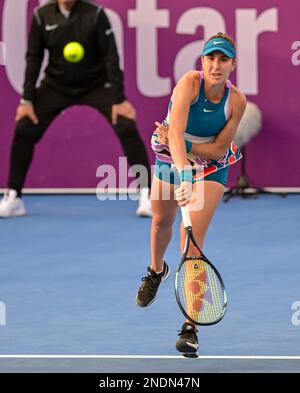 Doha, Qatar. 15th Feb, 2023. Belinda Bencic of Switzerland serves during the singles round of 16 match against Victoria Azarenka of Belarus at WTA500 Qatar Open 2023 in Doha, Qatar, Feb. 15, 2023. Credit: Nikku/Xinhua/Alamy Live News Stock Photo