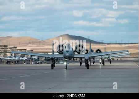 An A-10C Thunderbolt IIs assigned to the 354th Fighter Squadron, Davis-Monthan Air Force Base, Arizona, taxi prior to taking off for a mission during Red Flag 23-1 at Nellis Air Force Base, Nevada, Feb. 6, 2023. Red Flag allows U.S. and coalition forces to train together in high-end, realistic scenarios increasing interoperability of the joint force (U.S. Air Force photo by William R. Lewis) Stock Photo