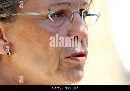 French Justice Minister Michele Alliot Marie speaks with Left to