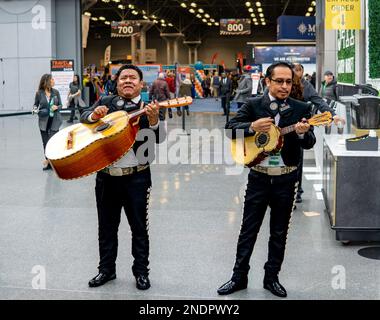 New York, NY - USA - Jan 28, 2023 Consulate General of Mexico's Mariachi band performing in front of the New York Travel and Adventure Show at the Jac Stock Photo