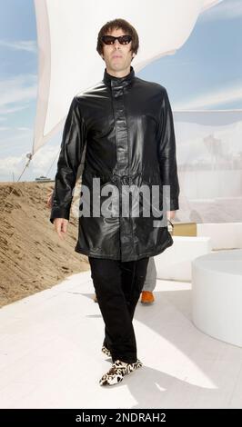 Musician Liam Gallagher poses for photographers before the Burberry