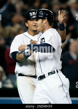 Detroit Tigers' Placido Polanco, right, is congratulated by Miguel Cabrera  after scoring in the third inning of a baseball game against the Kansas  City Royals, Saturday, Aug. 30, 2008, in Detroit. (AP