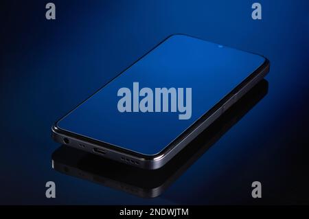 the smartphone is lying on a glass surface Stock Photo
