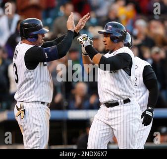 Florida Marlins' Miguel Olivo, right, celebrates with Aaron Boone