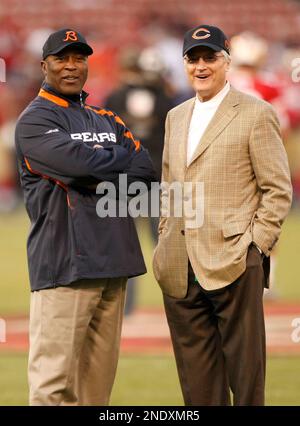 Chicago Bears chairman Michael McCaskey, left, and owner Virginia McCaskey  , center, react as they are presented with the George Halas Trophy after  the Bears beat the New Orleans Saints, 39-14, to