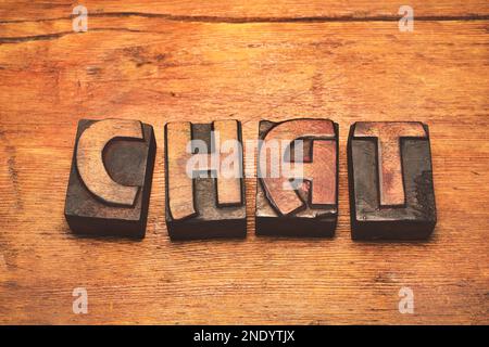 chat word made from scattered vintage letterpress blocks on wooden surface Stock Photo