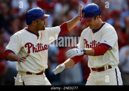 Philadelphia Phillies' Chase Utley, right, is congratulated by