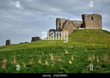 The Duffus Castle on the Laich of Moray with a cloudy sky in the background, Scotland Stock Photo