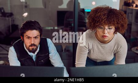 Serious, teamwork and digital with people at computer for programming, coding and software. Developer, technology and database with man and black Stock Photo