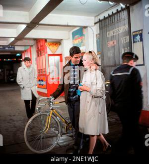 CATHERINE DENEUVE and NINO CASTELNUOVO in THE UMBRELLAS OF CHERBOURG (1964) -Original title: LES PARAPLUIES DE CHERBOURG-, directed by JACQUES DEMY. Credit: PARC FILMS / Album Stock Photo