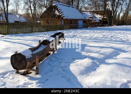 Ethnographic museum in Lublin. Poland, 08 February 2023.snow-covered troughs in front of an old farmhouse Stock Photo