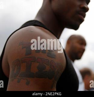 adrian peterson back tattoo