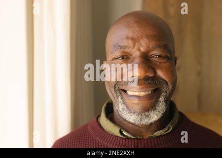 Portrait of african american senior man smiling at home. retirement senior lifestyle and living concept Stock Photo