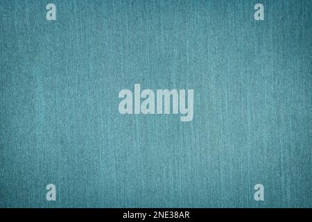 background of textured aquamarine fabric with vignette. Stock Photo