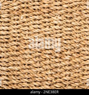 embossed background of large-weave rattan stems. Stock Photo