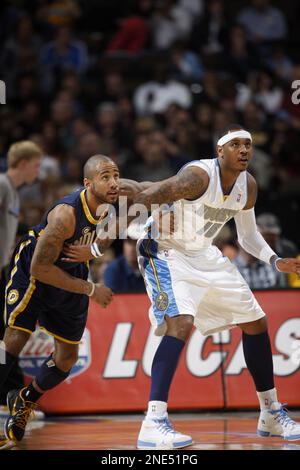 Denver Nuggets' Carmelo Anthony covers up his face after his team's 109-108  loss to Chicago Bulls in their NBA basketball game in Chicago,Thursday,  March 22, 2007. The Bulls won the game, 109-108. (