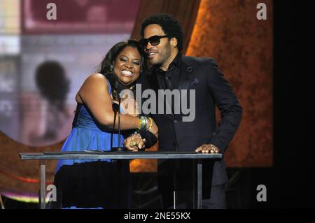 Sherri Shepherd and Lenny Kravitz present an award at the 41st NAACP