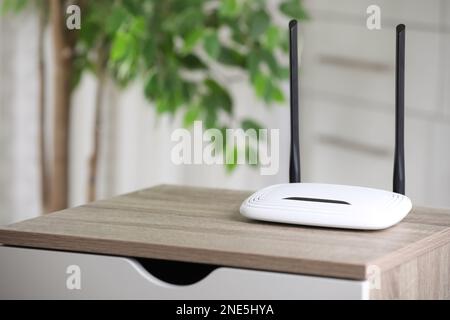 Modern Wi-Fi router indoors. Space for text Stock Photo