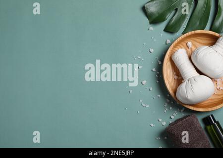 Flat lay composition with spa items on pale green background, space for text Stock Photo