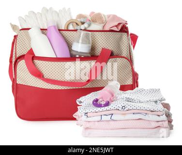 Mother's bag with baby's stuff isolated on white Stock Photo
