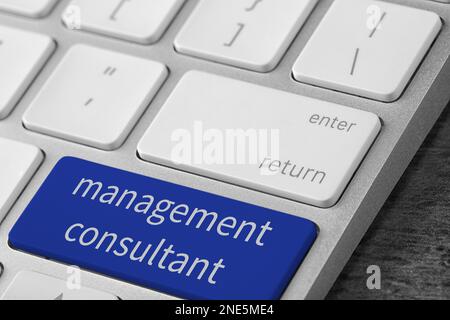 Button with text MANAGEMENT CONSULTANT on keyboard, closeup Stock Photo