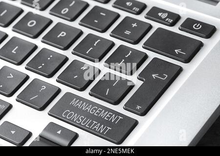 Button with text MANAGEMENT CONSULTANT on keyboard, closeup Stock Photo