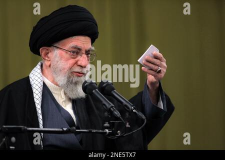 Tehran, Tehran, Iran. 15th Feb, 2023. A handout picture provided by the office of Iran's Supreme Leader Ayatollah ALI KHAMENEI on February 15, 2023, shows him in the capital Tehran addressing a gathering of people from the northwestern region of Iranian Azerbaijan. In this meeting, he greatly admired the Iranian nation for its 'historic'' turnout in this year's mass rallies to celebrate the 44th anniversary of the Islamic Revolution. 'This real, passionate, and meaningful epic is the result of the nation's persistence and not getting deviated from the path of the Revolution,'' he Stock Photo