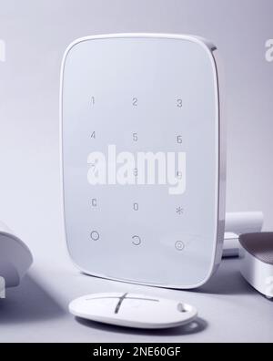 Smart House security system gadgets. Motion sensor, panic button, and alarm dinamic. Stock Photo