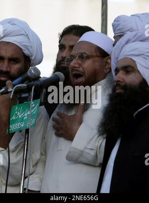 Hafiz Muhammad Saeed, center, the leader of a banned Islamic group