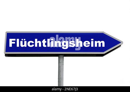 blue signpost lettering Fluechtlingsheim, refugee hostel Stock Photo