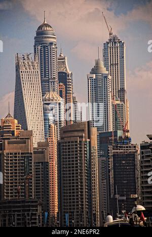 Iconic skyscrapers in Dubai including the DNA inspired, Cayan Tower (at left). Stock Photo