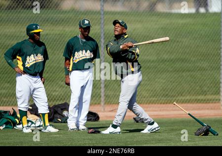 From left, Oakland Athletics 40th anniversary team members Rickey  Henderson, Joe Rudi and Dave Stewart laugh during a ceremony before the A's  baseball game against Seattle in Oakland, Calif., Sunday, Sept. 21