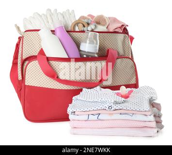 Mother's bag with baby's stuff isolated on white Stock Photo