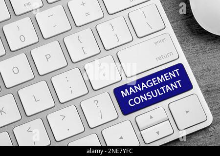 Button with text MANAGEMENT CONSULTANT on keyboard, closeup Stock Photo